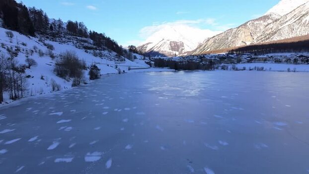 Aerial view of frozen Reschensee lake in Graun im Vinschgau Italy. Aerial view of frozen Reschensee lake in Graun im Vinschgau Italy.