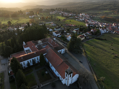 Vila Pouca da Beira Portugal 31 December 2023 Aerial view of Lam Hotel Convento do Desagravo with its red tiled roofs and bell tower overlooking the village and hazy hills. Vila Pouca da Beira Portugal 31 December 2023 Aerial view of Lam Hotel Convento do Desagravo with its red tiled roofs and bell tower overlooking the village and hazy hills.
