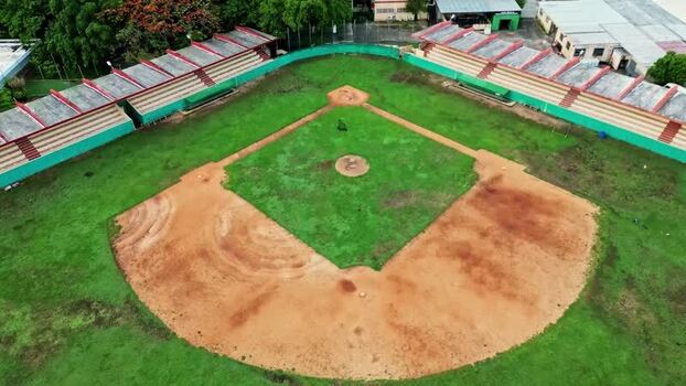 Aerial view of a baseball field with red dirt and green grass Mexico. Aerial view of a baseball field with red dirt and green grass Mexico.