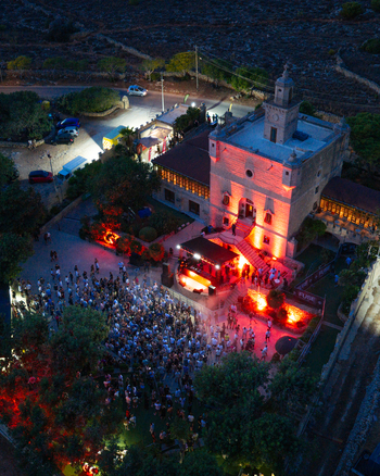 Mgarr Malta 17 September 2026 Aerial view of Castello Zamittello illuminated at night during an outdoor music event with a crowd of people gathered in the courtyard. Mgarr Malta 17 September 2026 Aerial view of Castello Zamittello illuminated at night during an outdoor music event with a crowd of people gathered in the courtyard.