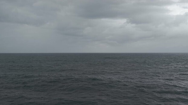 Aerial view of open water under cloudy sky Australia.