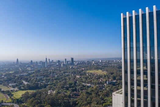 Aerial view of the modern skyscraper in Westlands overlooking the lush green cityscape of Nairobi Nairobi County Kenya. Aerial view of the modern skyscraper in Westlands overlooking the lush green cityscape of Nairobi Nairobi County Kenya.