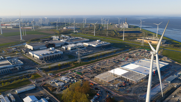 Eemshaven Netherlands 21 April 2026 Aerial view of the Google GRQ data center construction site surrounded by wind turbines and industrial infrastructure near the coast. Eemshaven Netherlands 21 April 2026 Aerial view of the Google GRQ data center construction site surrounded by wind turbines and industrial infrastructure near the coast.
