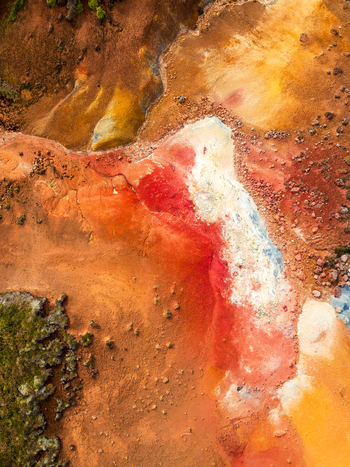 Aerial view of vibrant geothermal landscape with colorful mineral deposits volcanic soil and rocky terrain in Iceland. Aerial view of vibrant geothermal landscape with colorful mineral deposits volcanic soil and rocky terrain in Iceland.