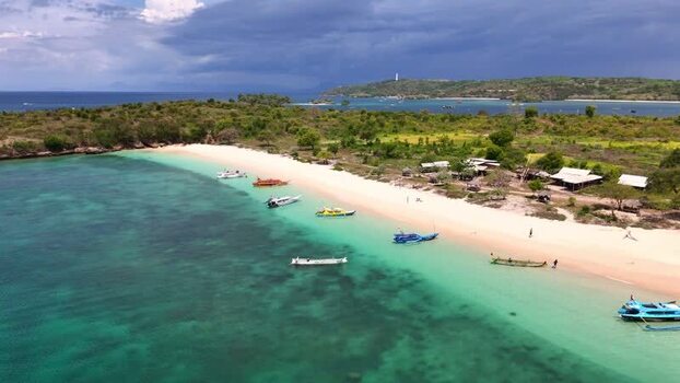 Aerial view of Pink Beach with boats and turquoise water Indonesia. Aerial view of Pink Beach with boats and turquoise water Indonesia.