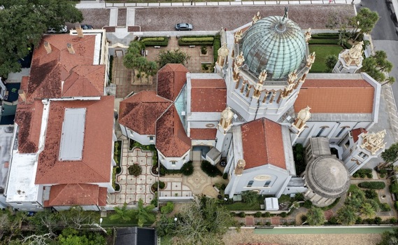 Aerial view of Memorial Presbyterian Church featuring its distinctive copper dome terracotta tiled roofs and intricate architectural details in St. Augustine Florida United States.