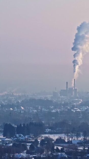 Aerial view of industrial plant in snowy landscape Latvia.