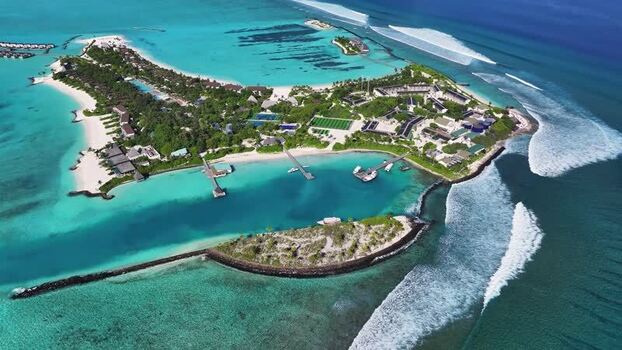 Aerial view of the tropical island resort and turquoise lagoon Maldives. Aerial view of the tropical island resort and turquoise lagoon Maldives.