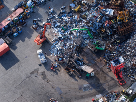 Melbourne Australia 22 September 2026 Aerial view of a scrap metal recycling facility in Kilsyth with heavy machinery excavators and large piles of metal waste. Melbourne Australia 22 September 2026 Aerial view of a scrap metal recycling facility in Kilsyth with heavy machinery excavators and large piles of metal waste.