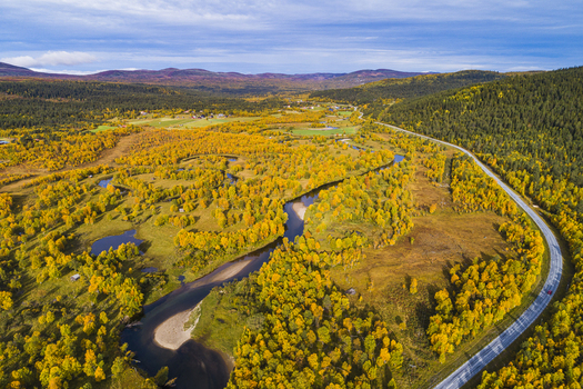 Aerial view of the Ljusnan river winding through the autumn forest in Bruksvallarna Jamtland County Sweden. Aerial view of the Ljusnan river winding through the autumn forest in Bruksvallarna Jamtland County Sweden.