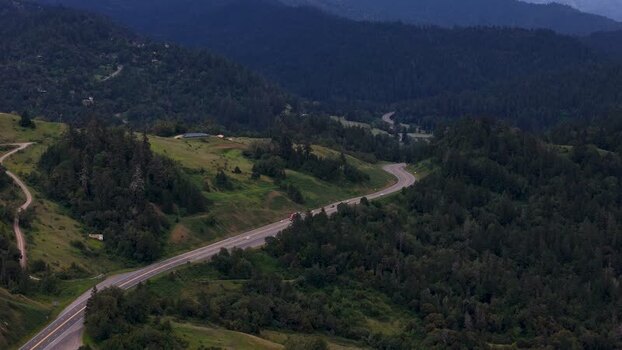 Aerial view of a winding highway through forests United States. Aerial view of a winding highway through forests United States.