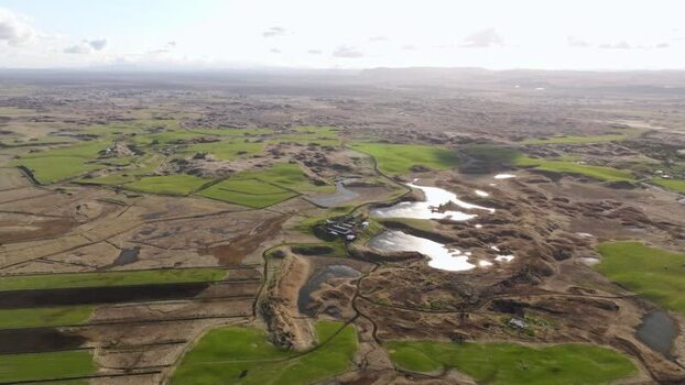 Aerial view of green fields and small lakes in Hella Iceland. Aerial view of green fields and small lakes in Hella Iceland.