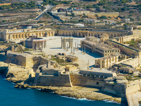 Aerial view of the historic Fort Manoel with its central parade ground stone fortifications and neoclassical architecture situated on the coast of Valletta Port Region Malta. Aerial view of the historic Fort Manoel with its central parade ground stone fortifications and neoclassical architecture situated on the coast of Valletta Port Region Malta.