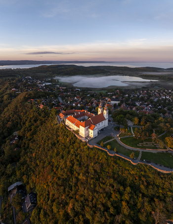 Aerial view of Tihany Abbey perched on a hill overlooking the town and Lake Balaton at sunset in Tihany Hungary. Aerial view of Tihany Abbey perched on a hill overlooking the town and Lake Balaton at sunset in Tihany Hungary.