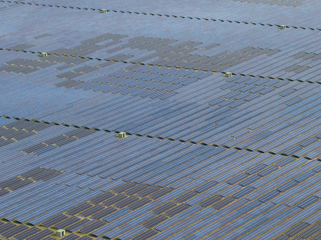 Aerial view of the solar farm at the former Military Airfield Preschen with rows of photovoltaic panels covering the historic runway and taxiway in Neisse Malxetal Brandenburg Germany. Aerial view of the solar farm at the former Military Airfield Preschen with rows of photovoltaic panels covering the historic runway and taxiway in Neisse Malxetal Brandenburg Germany.