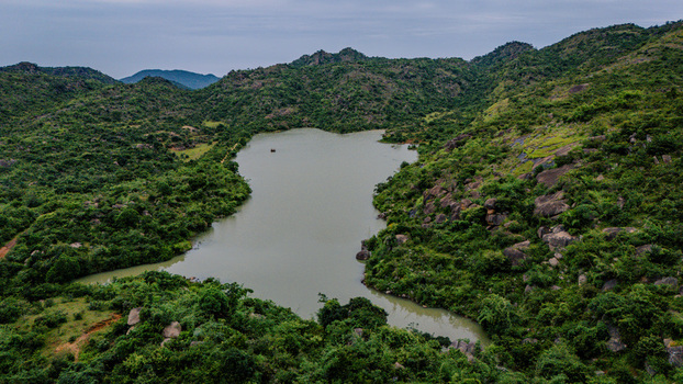 Aerial view of Lamingo Dam surrounded by lush green hills rocky outcrops and dense vegetation in Jos Jarawa Plateau Nigeria. Aerial view of Lamingo Dam surrounded by lush green hills rocky outcrops and dense vegetation in Jos Jarawa Plateau Nigeria.