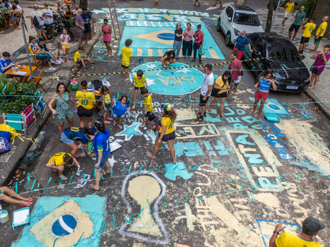 Rio de Janeiro Brazil 13 June 2026 Aerial view of people painting the street with Brazilian flags and football motifs in preparation for the World Cup 2026.