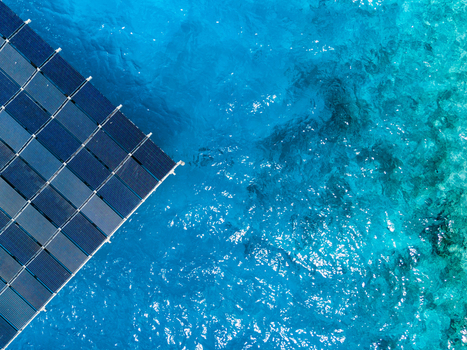 Aerial view of the SolarSea floating solar power plant by Swimsol on clear turquoise tropical water in Dharavandhoo Baa Atoll Maldives. Aerial view of the SolarSea floating solar power plant by Swimsol on clear turquoise tropical water in Dharavandhoo Baa Atoll Maldives.