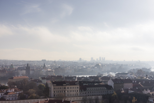 View of Charles Bridge and the historic rooftops of the Old Town under a hazy sky in Prague Prague Czechia. View of Charles Bridge and the historic rooftops of the Old Town under a hazy sky in Prague Prague Czechia.