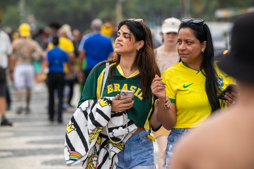 Rio de Janeiro Brazil 13 June 2026 View of two women wearing Brazil national football team jerseys walking through a crowd during the World Cup 2026 event.