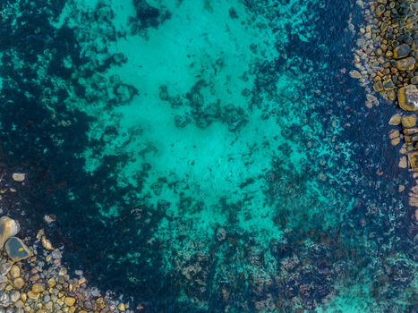 Aerial view of turquoise waters and rocky coastline at Torndirrup featuring clear ocean depths and rugged stone formations in Torndirrup Western Australia Australia. Aerial view of turquoise waters and rocky coastline at Torndirrup featuring clear ocean depths and rugged stone formations in Torndirrup Western Australia Australia.