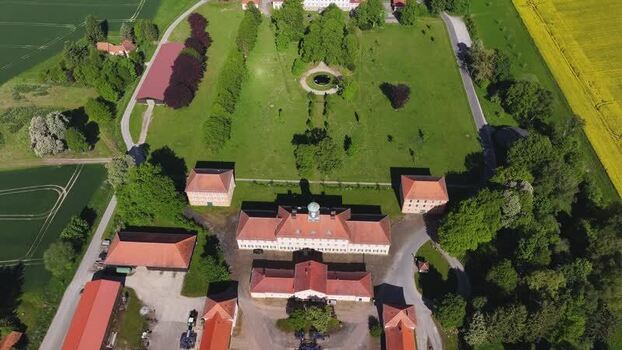 Aerial view of a historic manor house and green estate in Germany. Aerial view of a historic manor house and green estate in Germany.