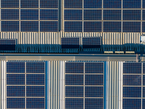 Aerial view of solar panels installed on a corrugated metal roof in Ancona Marche Italy. Aerial view of solar panels installed on a corrugated metal roof in Ancona Marche Italy.