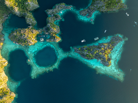 Aerial view of Twin Lagoon with turquoise waters and limestone cliffs in Coron Mimaropa Philippines. Aerial view of Twin Lagoon with turquoise waters and limestone cliffs in Coron Mimaropa Philippines.