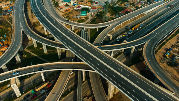 Aerial view of the multi level Pokuase Interchange with concrete pillars and flowing traffic in Ga North Municipal Greater Accra Region Ghana. Aerial view of the multi level Pokuase Interchange with concrete pillars and flowing traffic in Ga North Municipal Greater Accra Region Ghana.