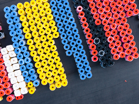 Aerial view of colorful polymer pipe coils arranged in organized rows for industrial infrastructure in Jelgava Latvia. Aerial view of colorful polymer pipe coils arranged in organized rows for industrial infrastructure in Jelgava Latvia.