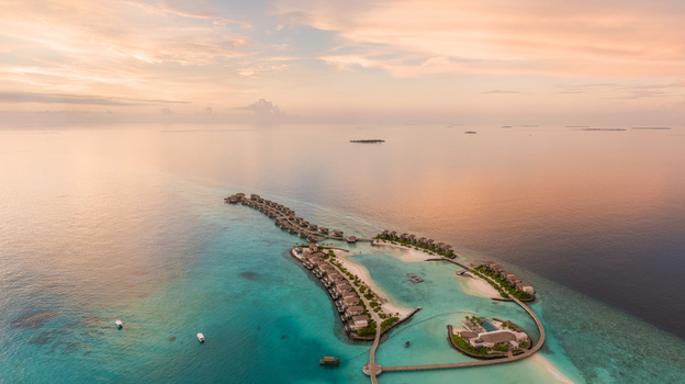 Aerial view of turquoise waters embrace the luxury overwater bungalows and pristine white sands creating a breathtaking island paradise Maldives Maldives. Aerial view of turquoise waters embrace the luxury overwater bungalows and pristine white sands creating a breathtaking island paradise Maldives Maldives.