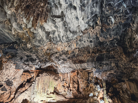 View of Cango Caves with ancient stalactites and limestone rock formations under artificial lighting in Oudtshoorn Western Cape South Africa. View of Cango Caves with ancient stalactites and limestone rock formations under artificial lighting in Oudtshoorn Western Cape South Africa.