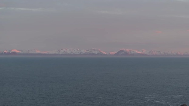 Aerial view of Lofoten mountains over the sea Norway.