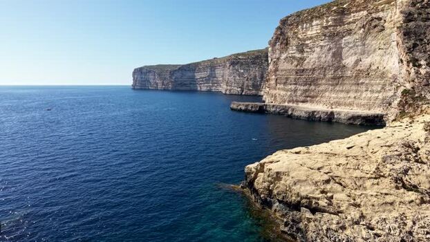 Aerial view of Xlendi cliffs and Mediterranean sea Malta. Aerial view of Xlendi cliffs and Mediterranean sea Malta.