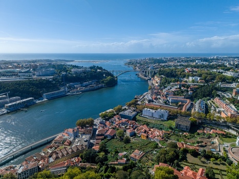 Aerial view of Ponte da Arrabida spanning the Douro River with the urban landscape of Porto Porto Portugal. Aerial view of Ponte da Arrabida spanning the Douro River with the urban landscape of Porto Porto Portugal.