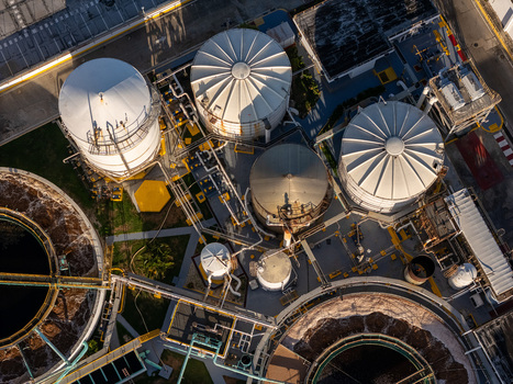Aerial view of the beer industrial complex featuring large storage tanks intricate piping systems and industrial infrastructure in Santo Domingo Dominican Republic. Aerial view of the beer industrial complex featuring large storage tanks intricate piping systems and industrial infrastructure in Santo Domingo Dominican Republic.
