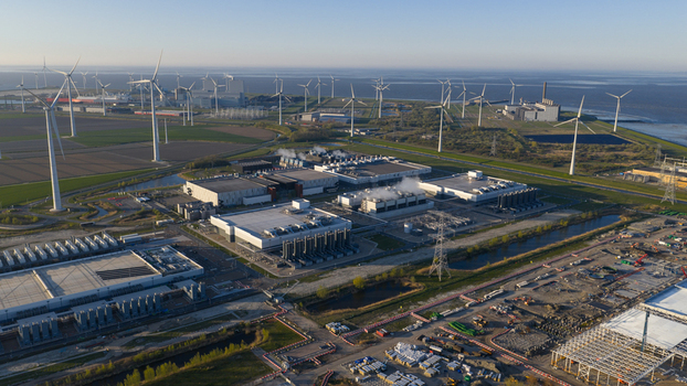 Drone view of a hyperscale data center in Eemshaven showing cloud computing server infrastructure cooling systems backup power and digital connectivity. Drone view of a hyperscale data center in Eemshaven showing cloud computing server infrastructure cooling systems backup power and digital connectivity.