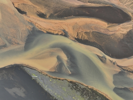 Aerial view of the meandering river channels and dark volcanic sand deposits near Selfoss Sveitarfelagid Arborg Iceland. Aerial view of the meandering river channels and dark volcanic sand deposits near Selfoss Sveitarfelagid Arborg Iceland.