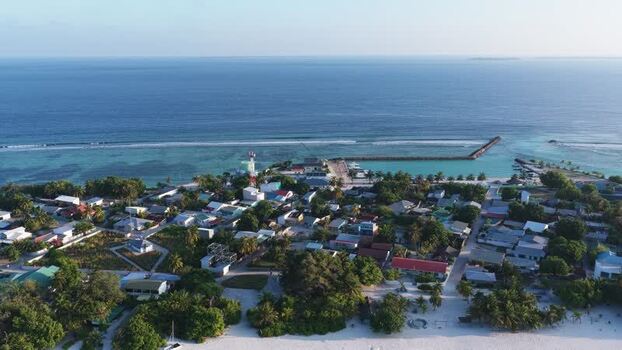Aerial view of the coastal village and harbor in Vashafaru Maldives. Aerial view of the coastal village and harbor in Vashafaru Maldives.