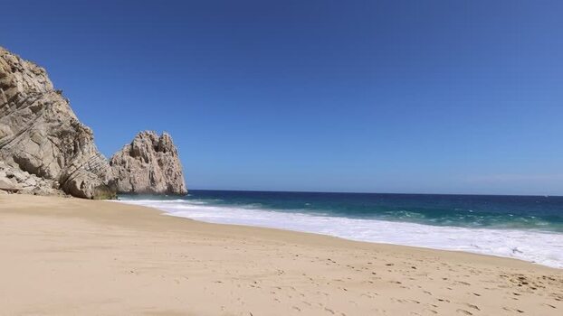 View of Los Arcos rock formations on the beach in Mexico.