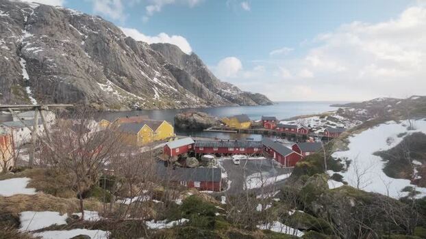 View of traditional red and yellow houses in Nusfjord Norway.