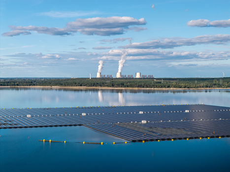Aerial view of the floating solar system on Cottbuser Ostsee with the Janschwalde Power Plant in the background Cottbus Brandenburg Germany. Aerial view of the floating solar system on Cottbuser Ostsee with the Janschwalde Power Plant in the background Cottbus Brandenburg Germany.