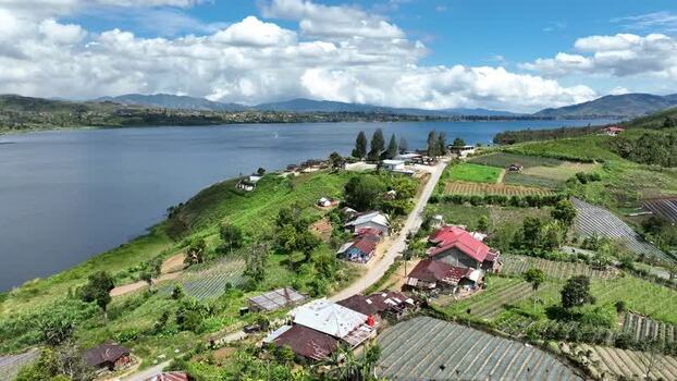 Aerial view of Alahan Panjang village and lake in Indonesia. Aerial view of Alahan Panjang village and lake in Indonesia.