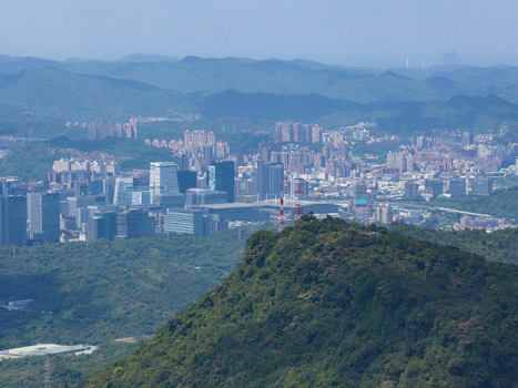 Aerial view of the Taipei City skyline featuring modern skyscrapers dense urban development and lush green mountains in the foreground Taipei City Taiwan. Aerial view of the Taipei City skyline featuring modern skyscrapers dense urban development and lush green mountains in the foreground Taipei City Taiwan.