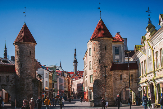 Tallinn Estonia 08 April 2026 View of the historic Viru Gate towers and the entrance to Vanalinn old town with people walking along the street under a clear blue sky. Tallinn Estonia 08 April 2026 View of the historic Viru Gate towers and the entrance to Vanalinn old town with people walking along the street under a clear blue sky.