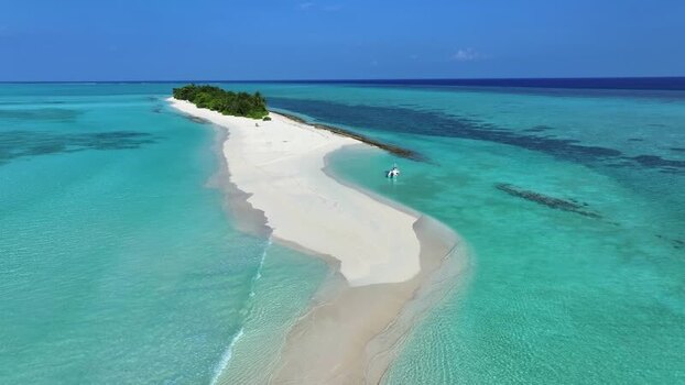 Aerial view of a tropical sandbank and turquoise sea Maldives.