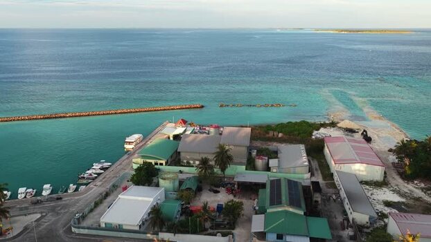 Aerial view of coastal buildings and a harbor Maldives.
