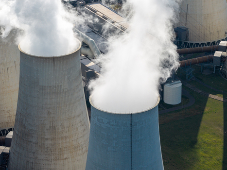 Aerial view of the Janschwalde Power Station with large cooling towers emitting steam showcasing industrial infrastructure in Peitz Brandenburg Germany. Aerial view of the Janschwalde Power Station with large cooling towers emitting steam showcasing industrial infrastructure in Peitz Brandenburg Germany.