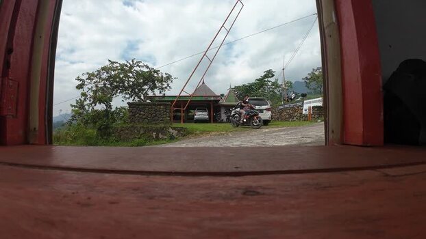 Aerial view of motorcycle and building near Rawa Gede Lake Indonesia.