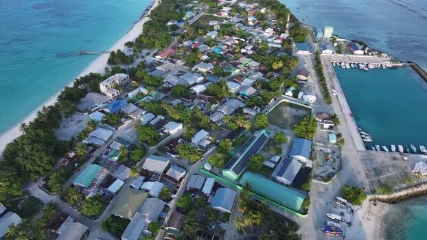 Aerial view of Vashafaru island village and harbor Maldives. Aerial view of Vashafaru island village and harbor Maldives.